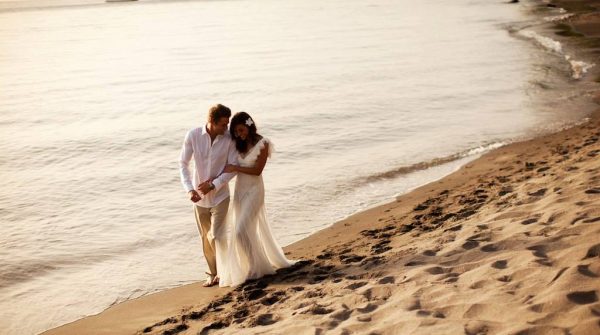 Caribbean wedding packages couple walking on beach
